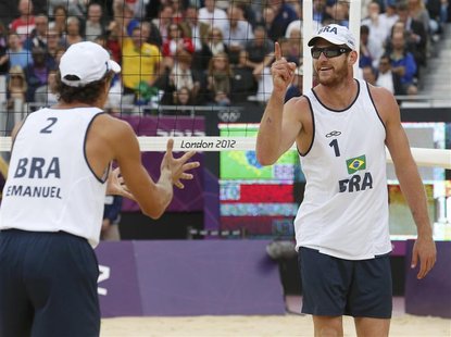 Brazil's Alison (R) and Emanuel celebrate a point against Latvia's Martins Plavins and Janis Smedins during their men's beach volleyball sem Brazil's Alison (R) and Emanuel celebrate a point against Latvia's Martins Plavins and Janis Smedins during their men's beach volleyball sem