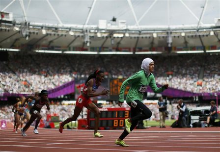 Saudi Arabia's Sarah Attar (R) starts her women's 800m round 1 heat during the London 2012 Olympic Games at the Olympic Stadium August 8, 20 Saudi Arabia's Sarah Attar (R) starts her women's 800m round 1 heat during the London 2012 Olympic Games at the Olympic Stadium August 8, 20