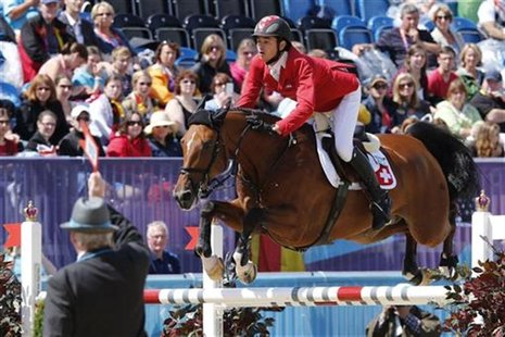 Switzerland's Steve Guerdat rides Nino des Buissonnets during the equestrian individual jumping second qualifier in Greenwich Park at the Lo Switzerland's Steve Guerdat rides Nino des Buissonnets during the equestrian individual jumping second qualifier in Greenwich Park at the Lo