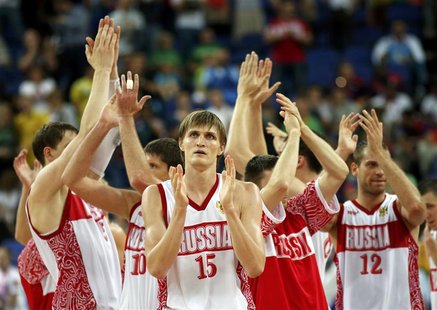 Russia's Andrei Kirilenko (C) and his teammates celebrate victory with the crowd after their men's quarterfinal basketball match against Lit Russia's Andrei Kirilenko (C) and his teammates celebrate victory with the crowd after their men's quarterfinal basketball match against Lit