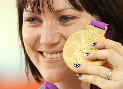 Australia's Anna Meares holds up her gold medal after the track cycling women's sprint finals at the Velodrome during the London 2012 Olympi Australia's Anna Meares holds up her gold medal after the track cycling women's sprint finals at the Velodrome during the London 2012 Olympi