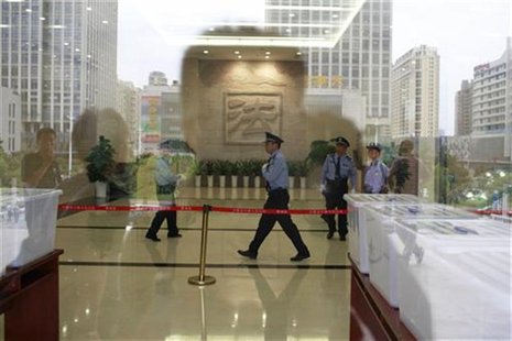 Police officers walk inside Hefei Intermediate People's Court, where the Gu Kailai trial will be held on Thursday, in Hefei, Anhui Province Police officers walk inside Hefei Intermediate People's Court, where the Gu Kailai trial will be held on Thursday, in Hefei, Anhui Province