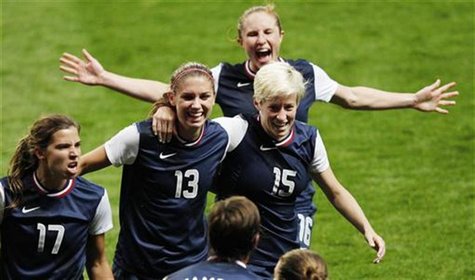 USA's Megan Rapinoe (15) celebrates with teammates after her corner kick went in for a goal against Canada in the women's semi final soccer USA's Megan Rapinoe (15) celebrates with teammates after her corner kick went in for a goal against Canada in the women's semi final soccer