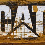 A scratched and worn Caterpillar logo is pictured at the back of a bulldozer in the rental equipment yard of Holt Caterpillar, the largest C