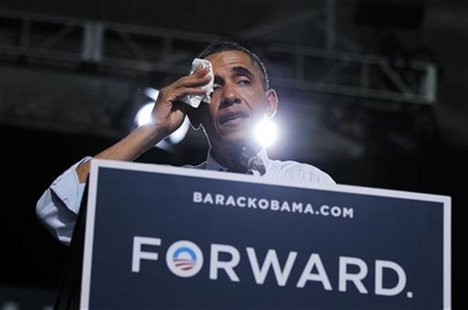 U.S. President Barack Obama wipes his brow in a hot gymnasium during an election campaign rally in Grand Junction, Colorado, August 8, 2012. U.S. President Barack Obama wipes his brow in a hot gymnasium during an election campaign rally in Grand Junction, Colorado, August 8, 2012.