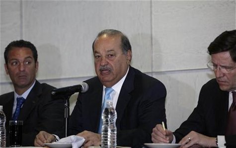 Mexican tycoon Carlos Slim (C) addresses the audience next to his son Carlos Slim Domit (L) and Oscar Von Hauske, general director of Telmex Mexican tycoon Carlos Slim (C) addresses the audience next to his son Carlos Slim Domit (L) and Oscar Von Hauske, general director of Telmex