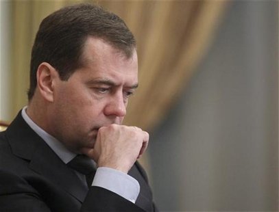Russia's Prime Minister Dmitry Medvedev looks on during a government session at the Russian White House, headquarters of the federal governm Russia's Prime Minister Dmitry Medvedev looks on during a government session at the Russian White House, headquarters of the federal governm
