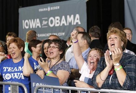 Women cheer as U.S. President Barack Obama speaks during a campaign rally at the Iowa State Fairgrounds in Des Moines, Iowa May 24, 2012. RE Women cheer as U.S. President Barack Obama speaks during a campaign rally at the Iowa State Fairgrounds in Des Moines, Iowa May 24, 2012. RE