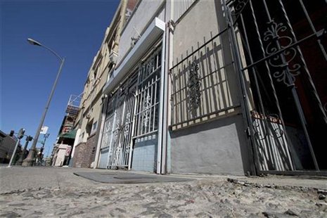 Crumbling sidewalks and shuttered businesses line a downtown street in Stockton, California, June 27, 2012. REUTERS/Kevin Bartram Crumbling sidewalks and shuttered businesses line a downtown street in Stockton, California, June 27, 2012. REUTERS/Kevin Bartram