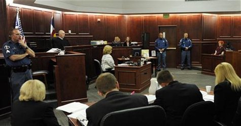 Colorado shooting suspect James Eagan Holmes (far right) makes his first court appearance in Aurora, Colorado, July 23, 2012. REUTERS/RJ San Colorado shooting suspect James Eagan Holmes (far right) makes his first court appearance in Aurora, Colorado, July 23, 2012. REUTERS/RJ San