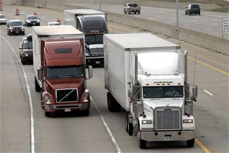 Two freight trucks are driven on the Fisher freeway in Detroit, Michigan March 27, 2009. REUTERS/Rebecca Cook Two freight trucks are driven on the Fisher freeway in Detroit, Michigan March 27, 2009. REUTERS/Rebecca Cook