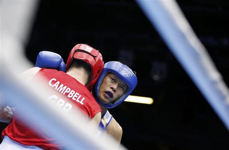 Britain's Luke Campbell (L) fights Japan's Satoshi Shimizu during their Men's Bantam (56kg) semi-final boxing match at the London Olympic Ga Britain's Luke Campbell (L) fights Japan's Satoshi Shimizu during their Men's Bantam (56kg) semi-final boxing match at the London Olympic Ga