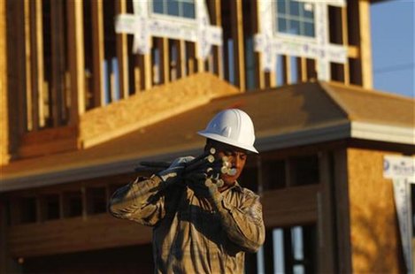 A worker carries materials for a house being constructed in Phoenix, Arizona, August 23, 2011. REUTERS/Joshua Lott A worker carries materials for a house being constructed in Phoenix, Arizona, August 23, 2011. REUTERS/Joshua Lott