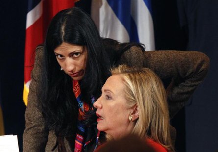 U.S. Secretary of State Hillary Clinton talks with her deputy chief of staff, Huma Abedin, during the Open Government Partnership event in N U.S. Secretary of State Hillary Clinton talks with her deputy chief of staff, Huma Abedin, during the Open Government Partnership event in N