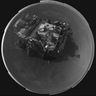 The Curiosity rover is seen in this stitched image taken by its Navigation cameras, located on the now-upright mast, in this picture release The Curiosity rover is seen in this stitched image taken by its Navigation cameras, located on the now-upright mast, in this picture release