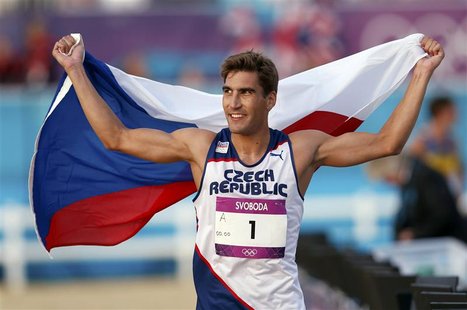 Winner David Svoboda of the Czech Republic celebrates with his national flag after the combined event of the men's modern pentathlon during Winner David Svoboda of the Czech Republic celebrates with his national flag after the combined event of the men's modern pentathlon during
