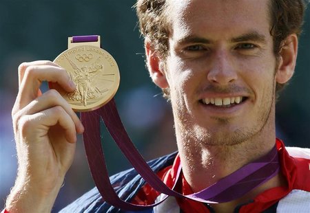 Britain's Andy Murray holds his gold medal during the presentation ceremony after winning the men's singles tennis gold medal match against Britain's Andy Murray holds his gold medal during the presentation ceremony after winning the men's singles tennis gold medal match against