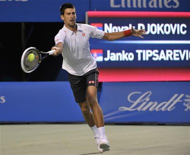 Novak Djokovic of Serbia returns a shot to compatriot Janko Tipsarevic during their semi-final match at the Toronto Masters tennis tournamen Novak Djokovic of Serbia returns a shot to compatriot Janko Tipsarevic during their semi-final match at the Toronto Masters tennis tournamen