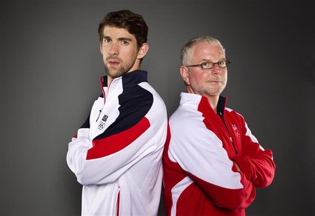 Swimmer Michael Phelps and his coach Bob Bowman (R) pose for a portrait during the 2012 U.S. Olympic Team Media Summit in Dallas, Texas May Swimmer Michael Phelps and his coach Bob Bowman (R) pose for a portrait during the 2012 U.S. Olympic Team Media Summit in Dallas, Texas May