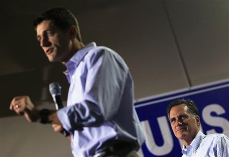 Republican presidential candidate Mitt Romney (R) listens to his vice president selection, U.S. Congressman Paul Ryan (R-WI) speak at a camp Republican presidential candidate Mitt Romney (R) listens to his vice president selection, U.S. Congressman Paul Ryan (R-WI) speak at a camp