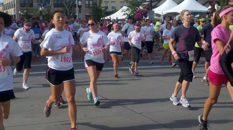 Runners at the 2012 Susan G Komen Race For The Cure in Wausau, WI Runners at the 2012 Susan G Komen Race For The Cure in Wausau, WI