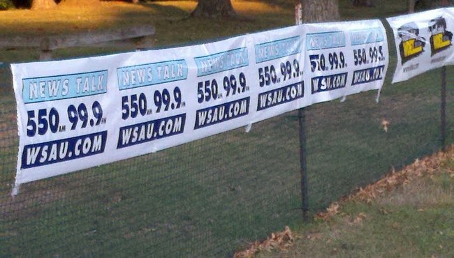 WSAU banners at the 2012 Mosinee Log Jam.