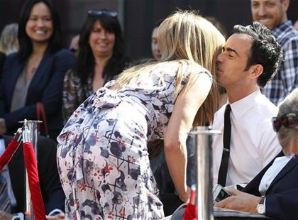 Actress Jennifer Aniston greets actor Justin Theroux before unveiling her star on the Walk of Fame in Hollywood, California February 22, 201 Actress Jennifer Aniston greets actor Justin Theroux before unveiling her star on the Walk of Fame in Hollywood, California February 22, 201