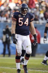 Chicago Bears middle linebacker Brian Urlacher walks off the field after the Seattle Seahawks scored a touchdown during the fourth quarter o