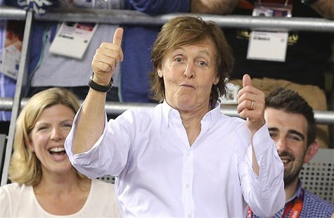 Paul McCartney celebrates after Britain's Dani King, Laura Trott and Joanna Rowsell won the track cycling women's team pursuit gold finals a Paul McCartney celebrates after Britain's Dani King, Laura Trott and Joanna Rowsell won the track cycling women's team pursuit gold finals a