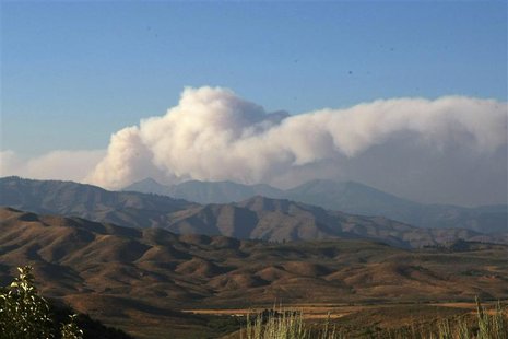 Smoke from the Trinity Ridge Fire rises over the mountains outside Pine, Idaho August 15 2012. Wildfires roared out of control across the su Smoke from the Trinity Ridge Fire rises over the mountains outside Pine, Idaho August 15 2012. Wildfires roared out of control across the su