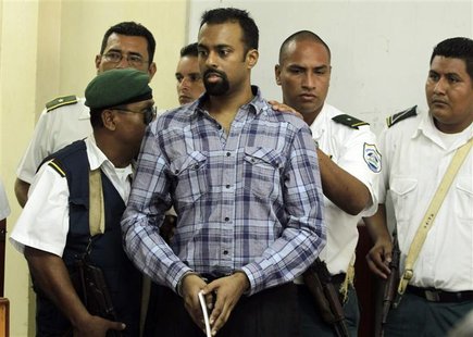 U.S citizen Jason Zachary Puracal is escorted by police during his arrival for his court appearance in Granada City, some 45 km (28 miles) s U.S citizen Jason Zachary Puracal is escorted by police during his arrival for his court appearance in Granada City, some 45 km (28 miles) s