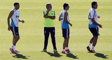 Karim Benzema (L), coach Jose Mourinho (2nd L), Mesut Ozil and Sami Khedira (R) attend a training session at Real Madrid's training grounds Karim Benzema (L), coach Jose Mourinho (2nd L), Mesut Ozil and Sami Khedira (R) attend a training session at Real Madrid's training grounds