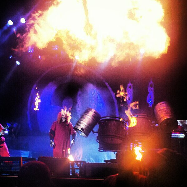 Clown of Slipknot accompanied by some massive fire cloud cover! Photo by Jake Raflik.