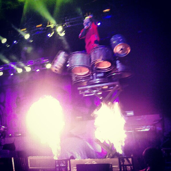 Clown of Slipknot atop his hydraulic drum stand above some insane flames! Photo by Jake Raflik.