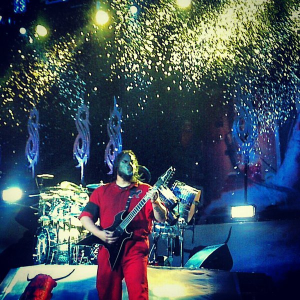Mick Thompson of Slipknot plays as snow begins to fall unto the stage during the song "Gently". Photo by Trevor Worzalla