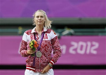 Russia's Maria Sharapova poses with her silver medal after receiving it during the presentation ceremony following the women's singles gold Russia's Maria Sharapova poses with her silver medal after receiving it during the presentation ceremony following the women's singles gold