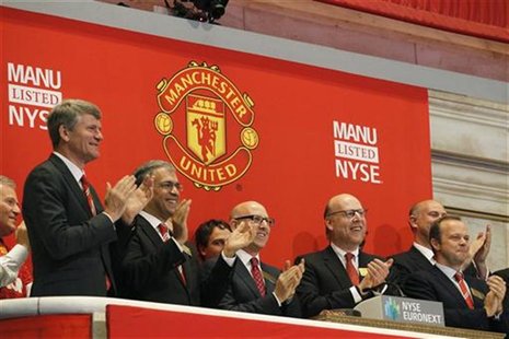 Manchester United executives and owners Joel (3rd L) and Avram Glazer (2nd R) ring the opening bell in celebration of Manchester United Ltd Manchester United executives and owners Joel (3rd L) and Avram Glazer (2nd R) ring the opening bell in celebration of Manchester United Ltd