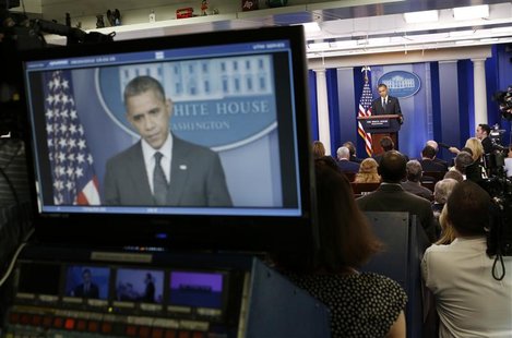 U.S. President Barack Obama is seen on a television monitor as he speaks in the press briefing room at the White House in Washington, August U.S. President Barack Obama is seen on a television monitor as he speaks in the press briefing room at the White House in Washington, August