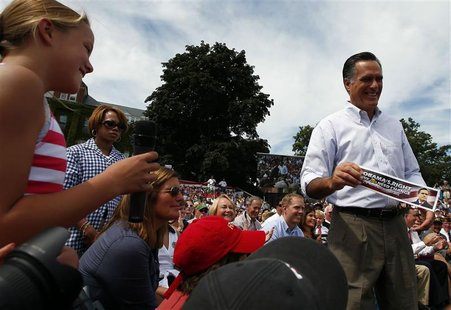 U.S. Republican presidential candidate and former Massachusetts Governor Mitt Romney accepts a bumper sticker reading: "Obama's Right We Do U.S. Republican presidential candidate and former Massachusetts Governor Mitt Romney accepts a bumper sticker reading: "Obama's Right We Do