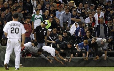 Fans reach for a foul ball during the MLB American League baseball game between Chicago White Sox and New York Yankees, in Chicago, August 2 Fans reach for a foul ball during the MLB American League baseball game between Chicago White Sox and New York Yankees, in Chicago, August 2
