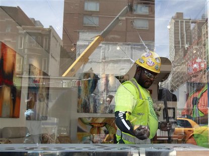 Construction workers clean up an art gallery that was damaged following a blast at a subway construction site in New York August 21, 2012. R Construction workers clean up an art gallery that was damaged following a blast at a subway construction site in New York August 21, 2012. R