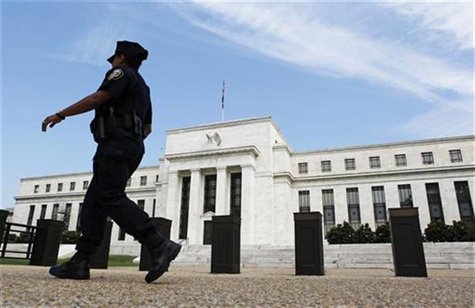 A police officer walks in front of the Federal Reserve in Washington August 22, 2012. REUTERS/Larry Downing A police officer walks in front of the Federal Reserve in Washington August 22, 2012. REUTERS/Larry Downing