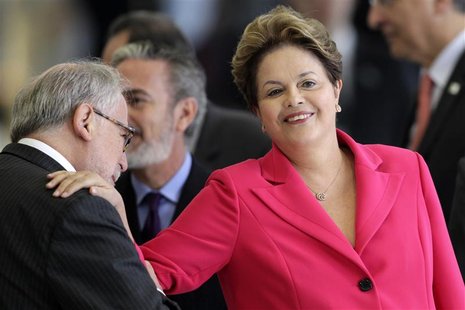 Brazil's President Dilma Rousseff (R) attends an arrival ceremony before a ceremony for signing acts between Brazil and Venezuela in the Pla Brazil's President Dilma Rousseff (R) attends an arrival ceremony before a ceremony for signing acts between Brazil and Venezuela in the Pla