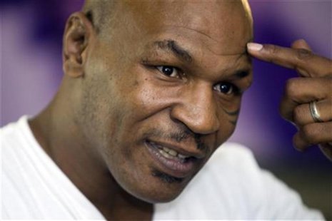 Former undisputed heavyweight boxing champion Mike Tyson points to his head during an interview at the MGM Grand Hotel and Casino in Las Veg Former undisputed heavyweight boxing champion Mike Tyson points to his head during an interview at the MGM Grand Hotel and Casino in Las Veg