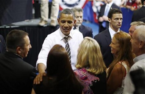 U.S. President Barack Obama meets with audience members during an event on extending the Bush-era tax cuts for middle class families at Kirk U.S. President Barack Obama meets with audience members during an event on extending the Bush-era tax cuts for middle class families at Kirk