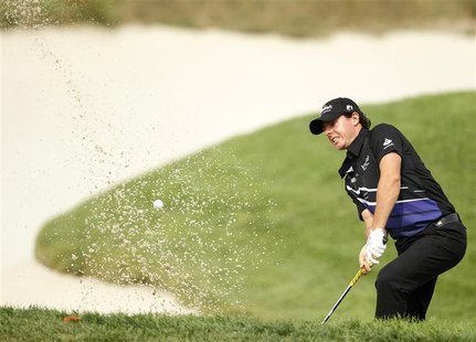 Rory McIlroy of Northern Ireland hits out of a sand trap on the 16th hole during the first round of the PGA golf tournament on the Black Cou Rory McIlroy of Northern Ireland hits out of a sand trap on the 16th hole during the first round of the PGA golf tournament on the Black Cou