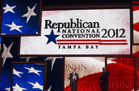 Republican National Committee Chairman Reince Priebus (C) unveils the stage for the upcoming Republican National Convention alongside conven Republican National Committee Chairman Reince Priebus (C) unveils the stage for the upcoming Republican National Convention alongside conven