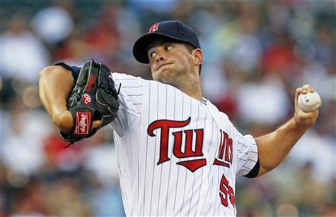 Minnesota Twins starting pitcher Scott Diamond throws against Baltimore Orioles batter Nick Markakis during the first inning of their MLB ba Minnesota Twins starting pitcher Scott Diamond throws against Baltimore Orioles batter Nick Markakis during the first inning of their MLB ba