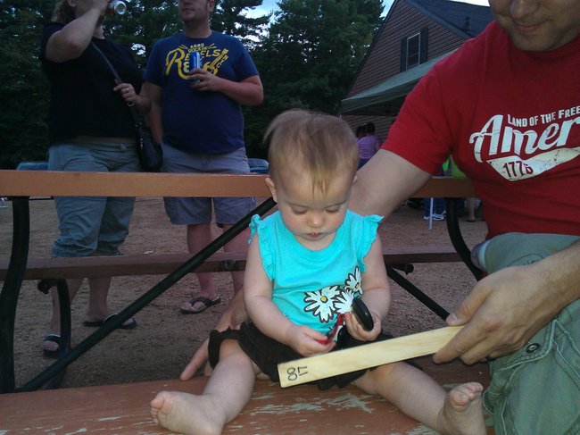 Mia holding my paddles for the Fishin' for a Cure Paddle Raffles