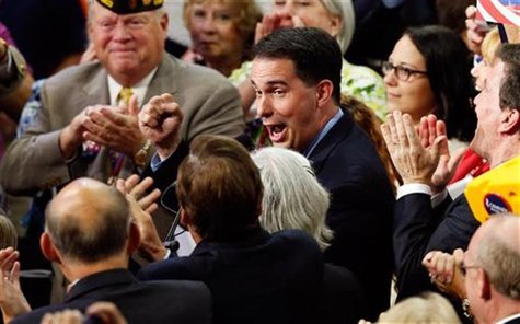 Wisconsin Governor Scott Walker pumps his fist as he announces his state's vote totals after Republican presidential nominee Mitt Romney sec Wisconsin Governor Scott Walker pumps his fist as he announces his state's vote totals after Republican presidential nominee Mitt Romney sec